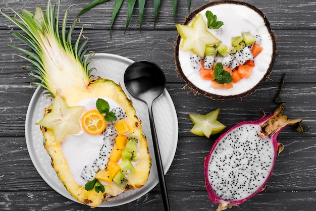 Free Photo fruit salad in coconut plate top view