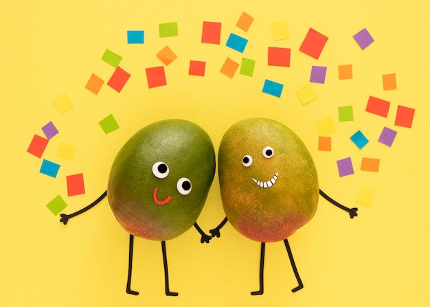 Free photo fruits holding hands with confetii