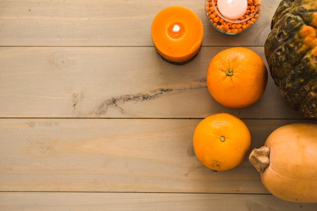 Fruits and vegetables near burning candle