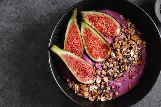 Free photo fruity bowl with muesli granola and figs served in bowl