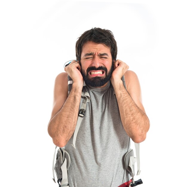 frustrated backpacker over isolated white background