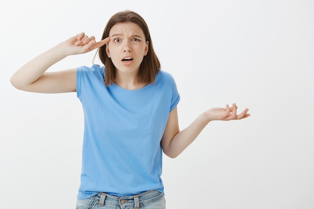 Frustrated and pissed-off woman scolding someone being strange or crazy