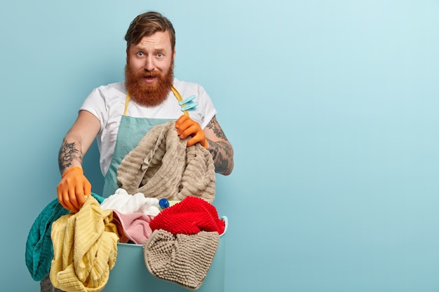 Frustrated redhaired man with trendy haircut, thick beard