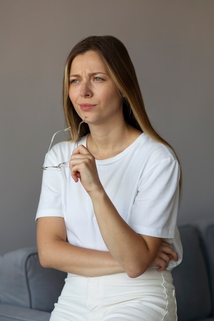 Frustrated woman with glasses side view