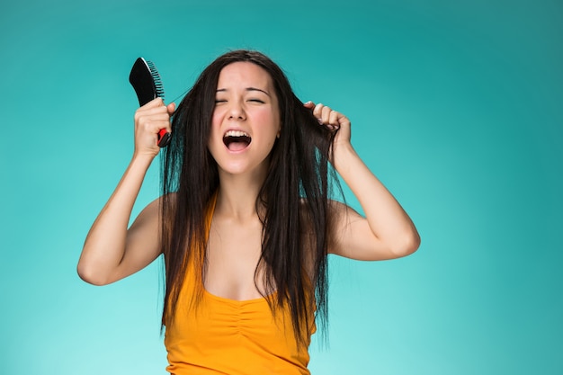 Free photo frustrated young woman having a bad hair