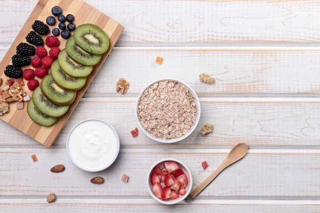 Fruts with yougurt and granola on desk