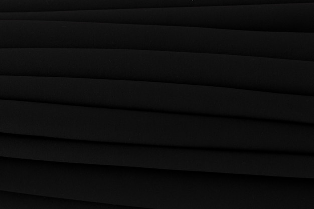 Full frame of folded black curtain