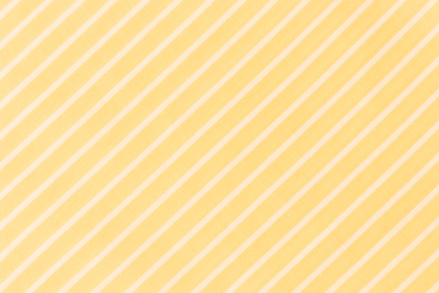 Full frame of white diagonal lines on yellow background