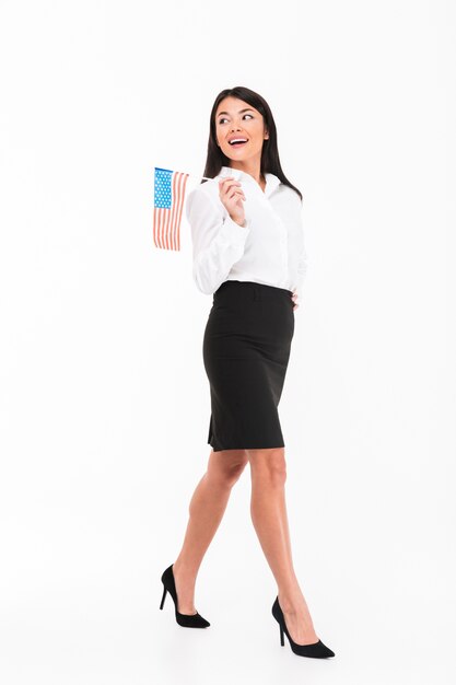 Full length portrait of a cheerful asian businesswoman