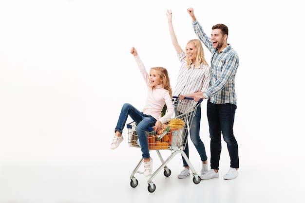 Full length portrait of a cheerful family