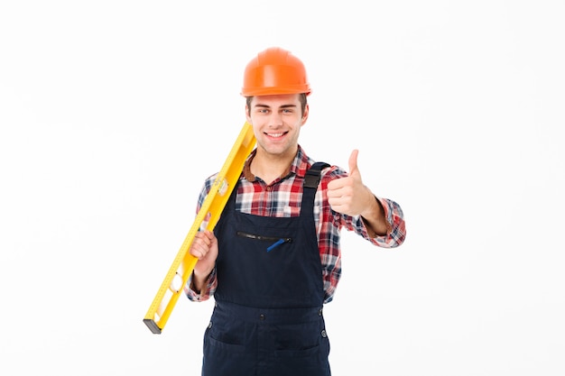 Free photo full length portrait of a confident young male builder