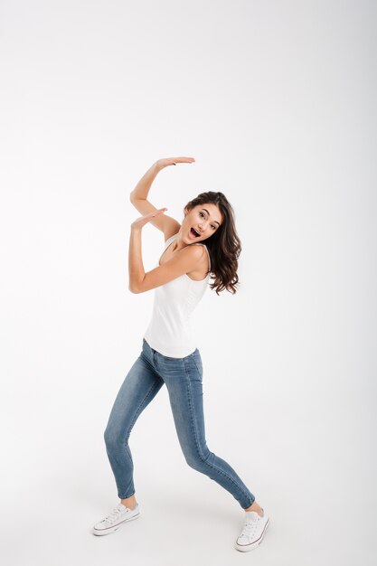 Full length portrait of an excited woman