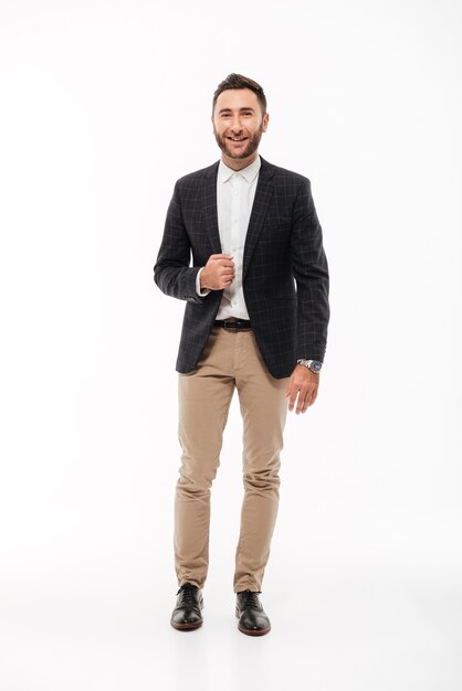 Full length portrait of a smiling confident man