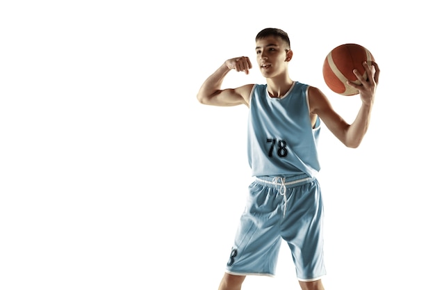 Full length portrait of young basketball player with a ball isolated on white studio background. Teenager celebrating winning. Concept of sport, movement, healthy lifestyle, ad, action, motion.