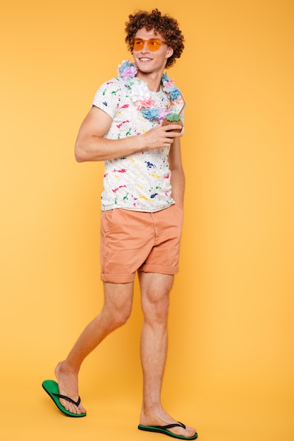 Full length portrait of a young man in summer clothes