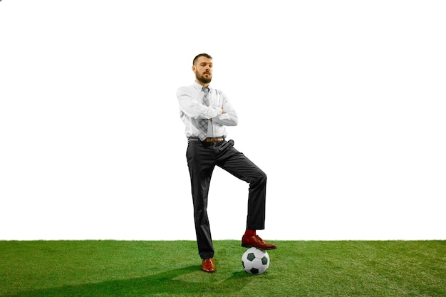 Free photo full length shot of a young businessman playing football isolated on white background.