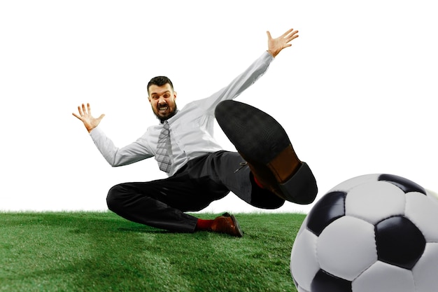 Free photo full length shot of a young businessman playing football isolated on white wall