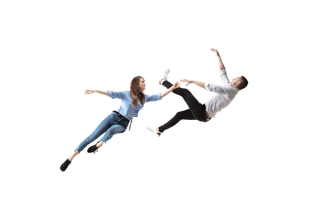 Free photo full length shot of young woman and man hovering in air