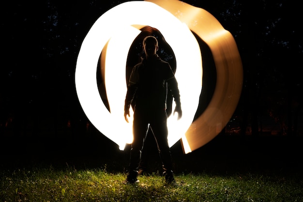 Free photo full shot adult posing with bright light