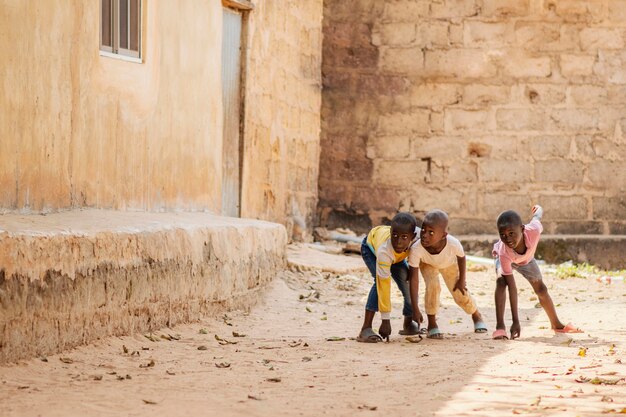 Full shot african boys playing together