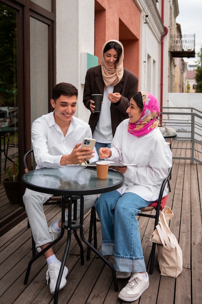 Full shot arab people spending time together