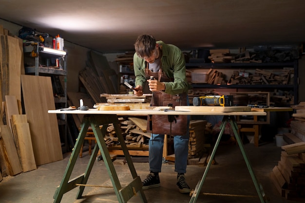 Free Photo full shot artisan doing woodcutting