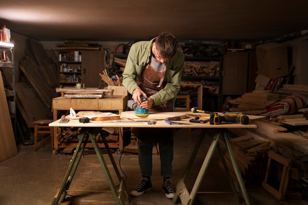 Free Photo full shot artisan doing woodcutting