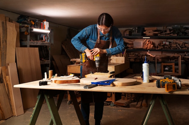 Free Photo full shot artisan doing woodcutting