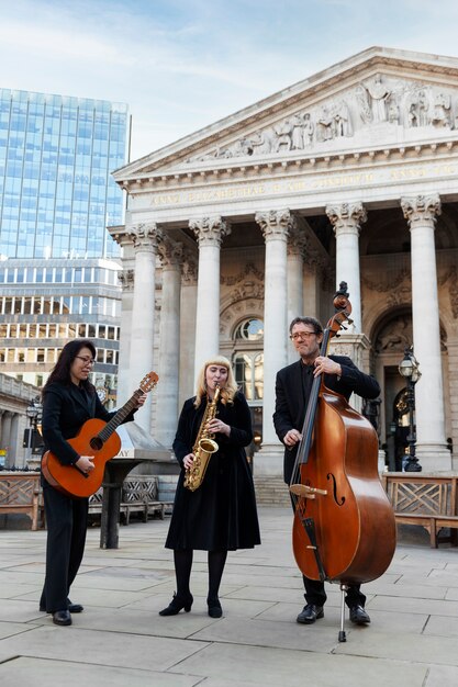 Full shot artists making jazz music outdoors