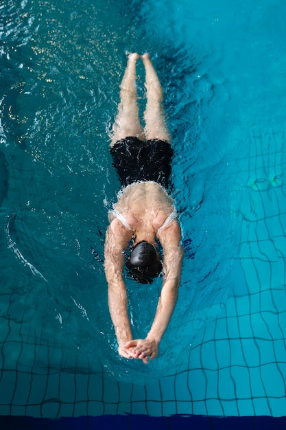 Full shot athlete swimming