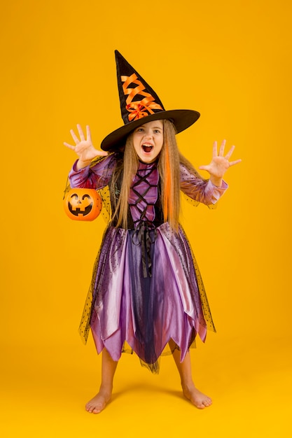 Full shot of beautiful girl with witch costume