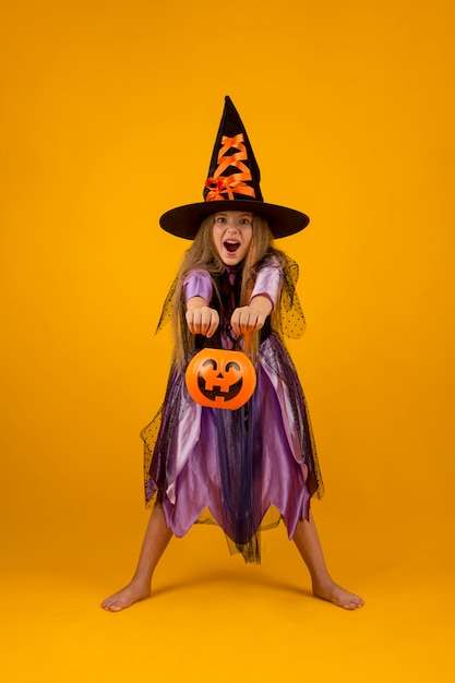 Full shot of beautiful girl with witch costume