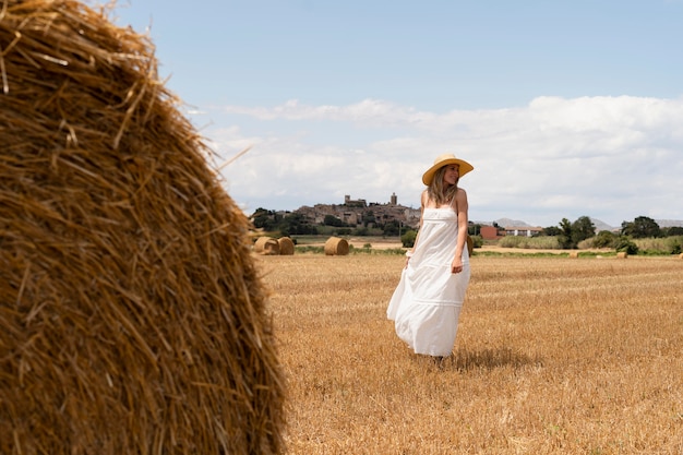 Free Photo full shot beautiful woman posing with hat