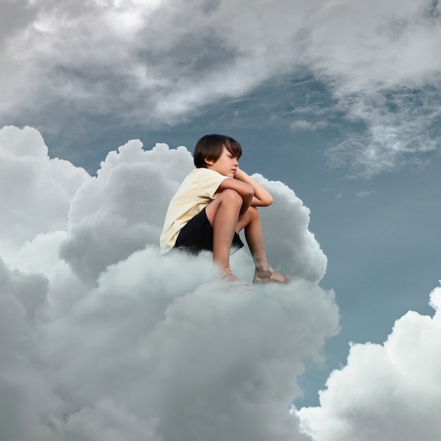 Free Photo full shot boy thinking on cloud