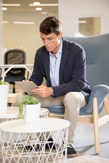 Free Photo full shot business man sitting down