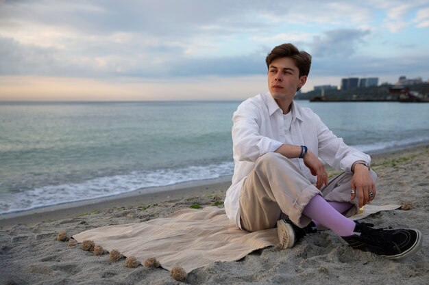 Full shot contemplative man at the seaside