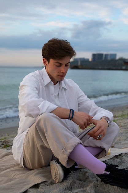 Full shot contemplative man at the seaside