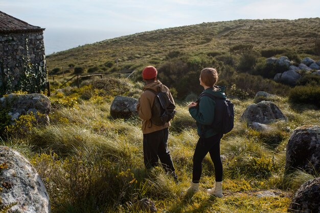 Full shot couple on a hiking trip