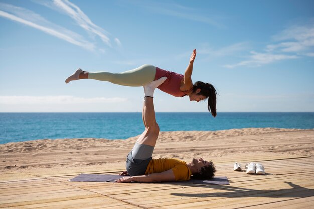 Full shot couple training together outdoors