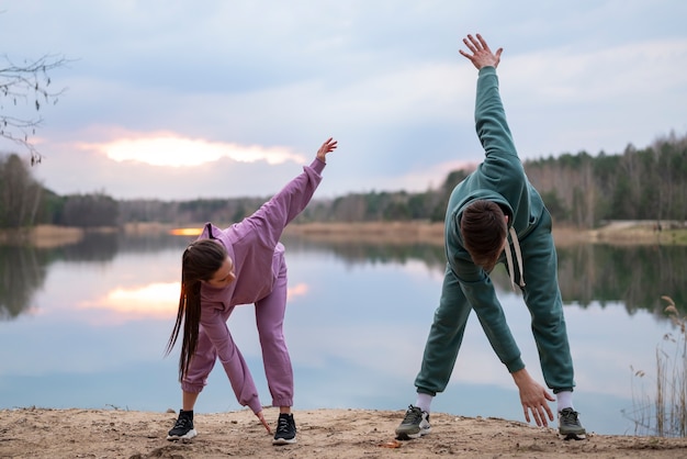 Free photo full shot couple training together