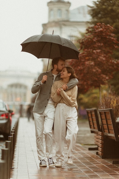 Full shot couple walking outdoors