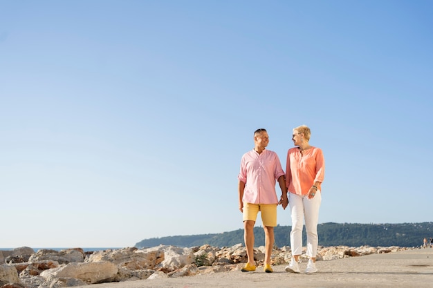 Full shot couple walking together