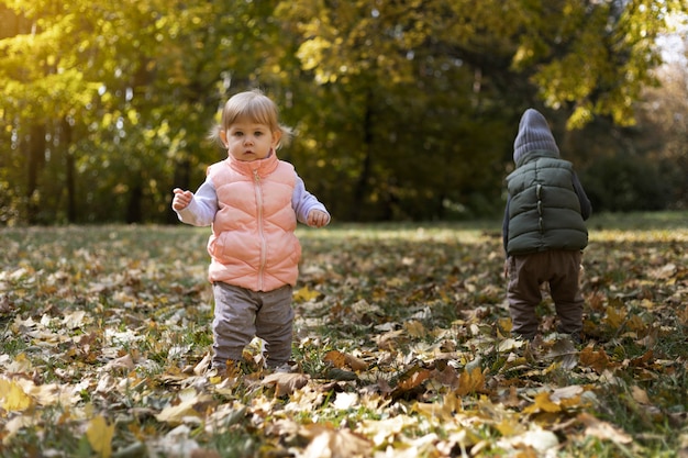 Free photo full shot cute kids playing outdoors