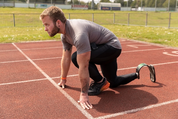 Full shot disabled man ready to run