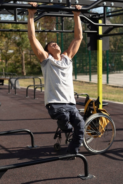 Full shot disabled man training arms