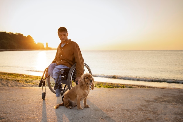 Free Photo full shot disabled man with dog