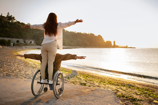 Full shot disabled man and woman in vacation