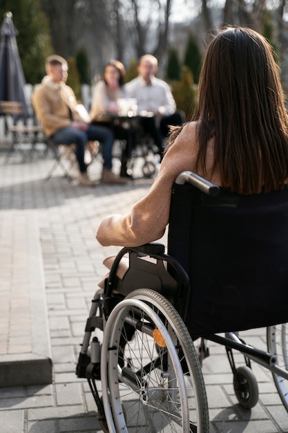 Free photo full shot disabled woman with friends