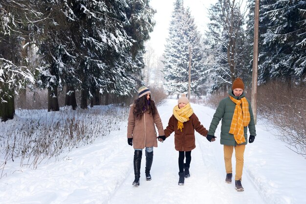 Full shot family members holding hands