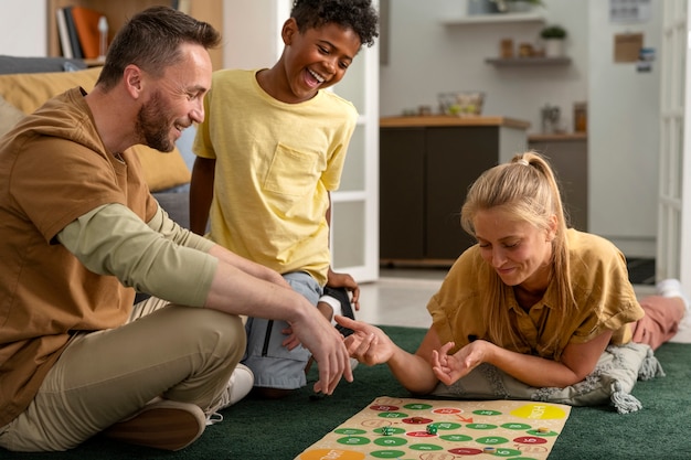 Full shot family members playing game